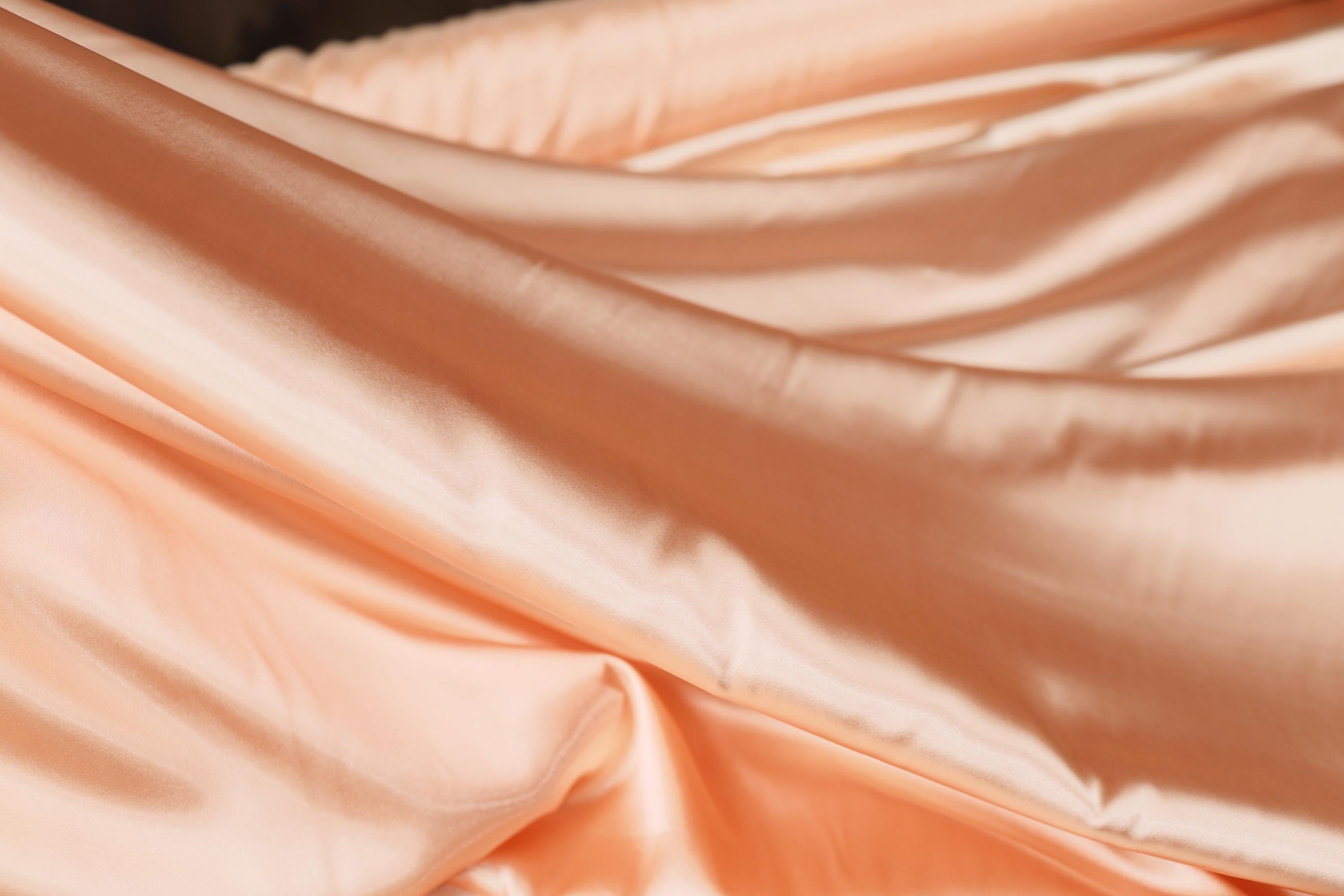 a close up of a pink satin fabric