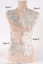 A mannequin with various decorative pieces of fabric and lace attached to its bust area, labeled with different styles.