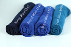 four rolled-up blue fabric pieces, each with a different color label indicating the color of the fabric.