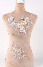 A mannequin with a beige body and a floral design on its chest area.