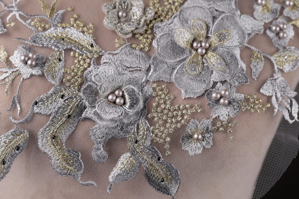 a close up of a dress with flowers on it