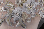a close up of a dress with flowers on it
