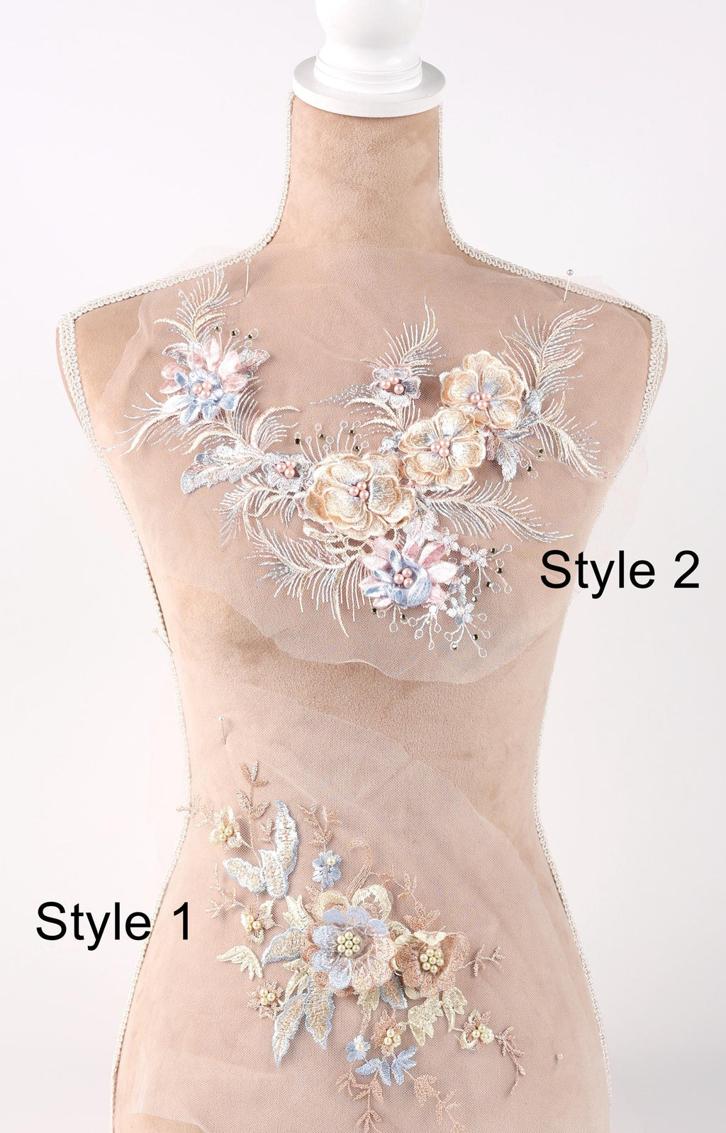 A mannequin with a beige body and a floral design on the bust area, featuring various shades of blue, pink, and white flowers and leaves.