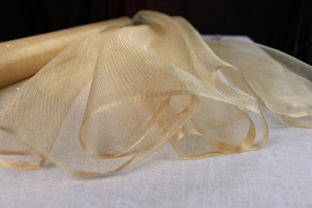 a roll of sheer fabric sitting on top of a table