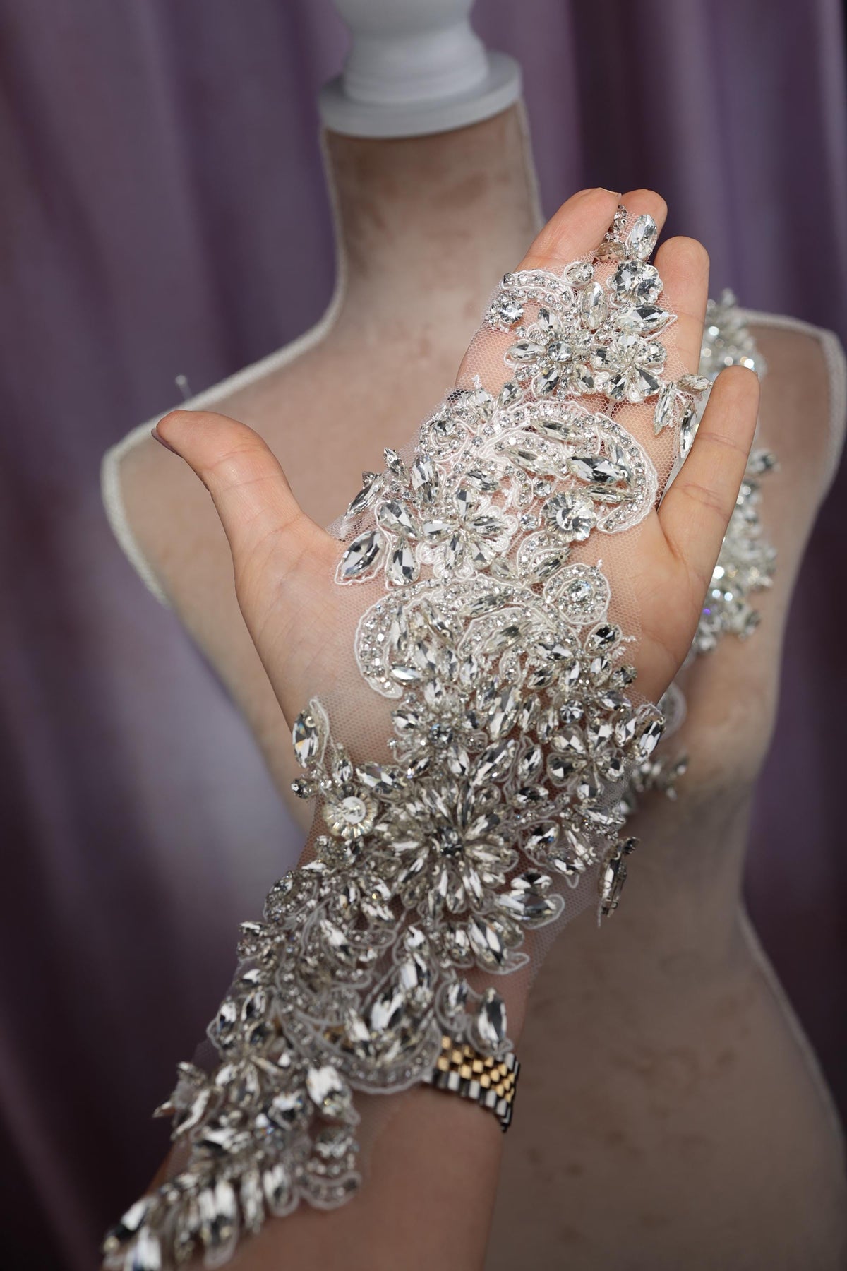 a woman's hand holding a bunch of diamonds