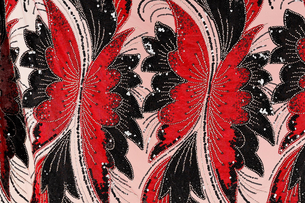 a close-up view of a fabric with a striking pattern of red and black butterflies. The butterflies are intricately designed with black and red sequins, giving the fabric a vibrant and eye-catching appearance. The butterflies are arranged in a repeating pattern, creating a sense of rhythm and movement across the fabric.