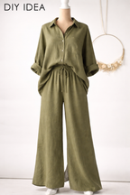 a mannequin wearing a green button-up shirt and wide-leg pants.