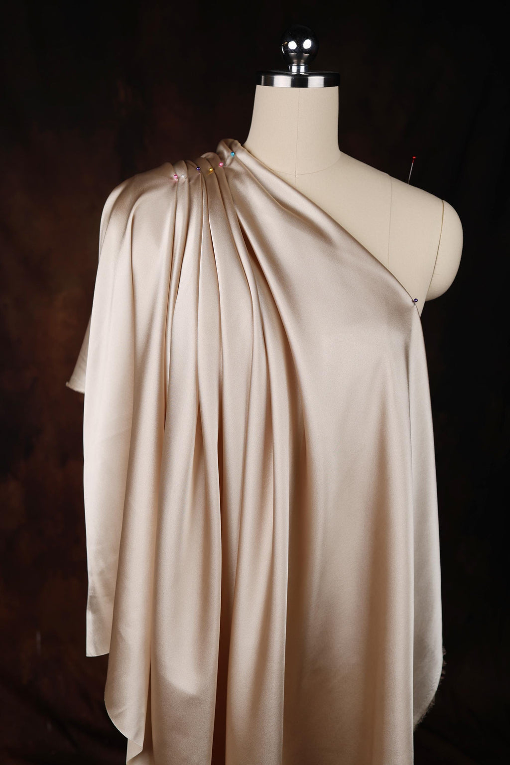 a dress on a mannequin on a black background