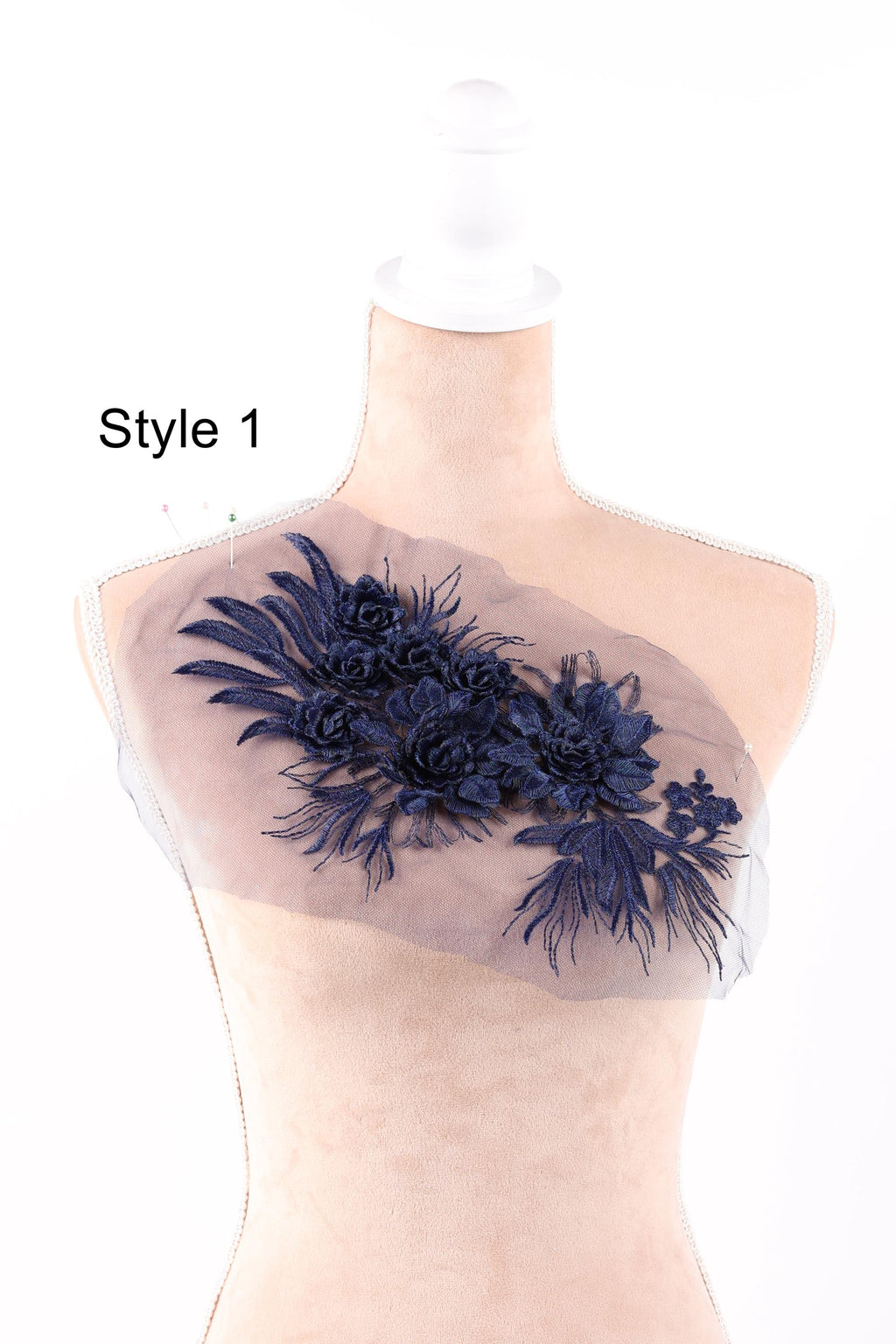 A mannequin with a decorative blue floral embroidered on its bust area, labeled as "Style 1".