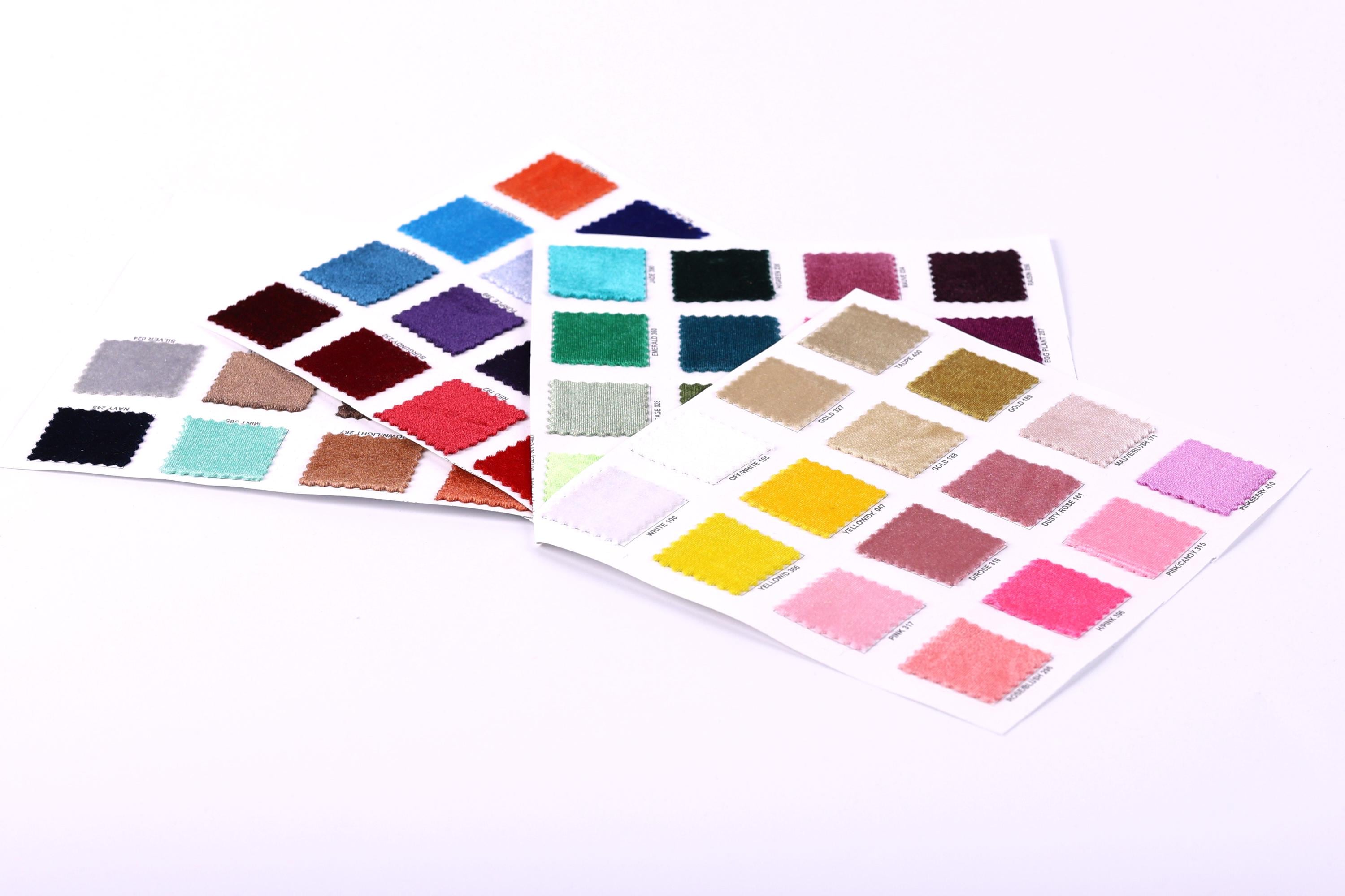 a collection of fabric swatches in various colors, including shades of blue, green, purple, orange, and pink.