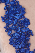 a close up of a piece of cloth with blue flowers on it