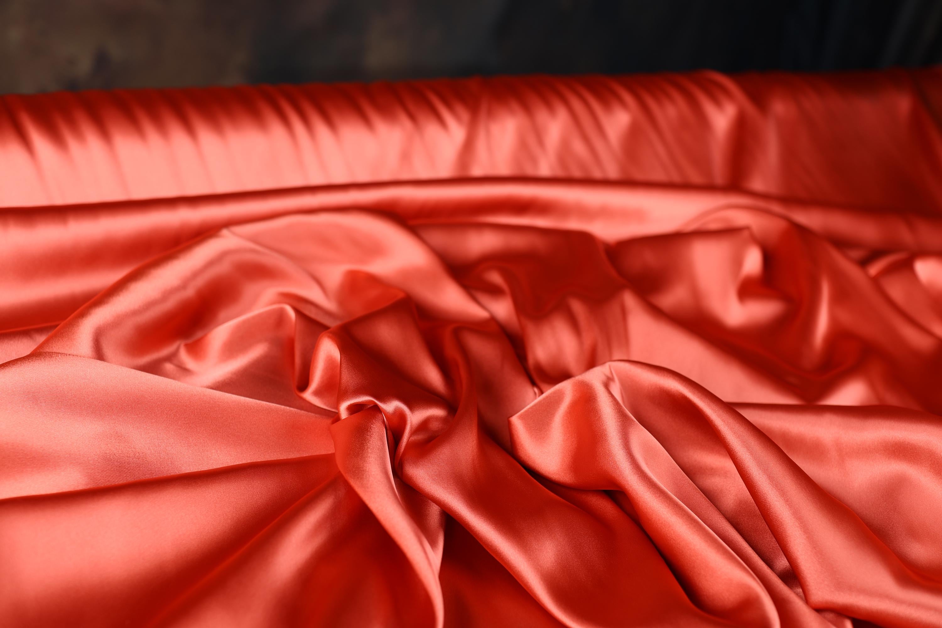 a close up of a red satin material