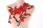 a mannequin with a red flower embroidered on its bust.