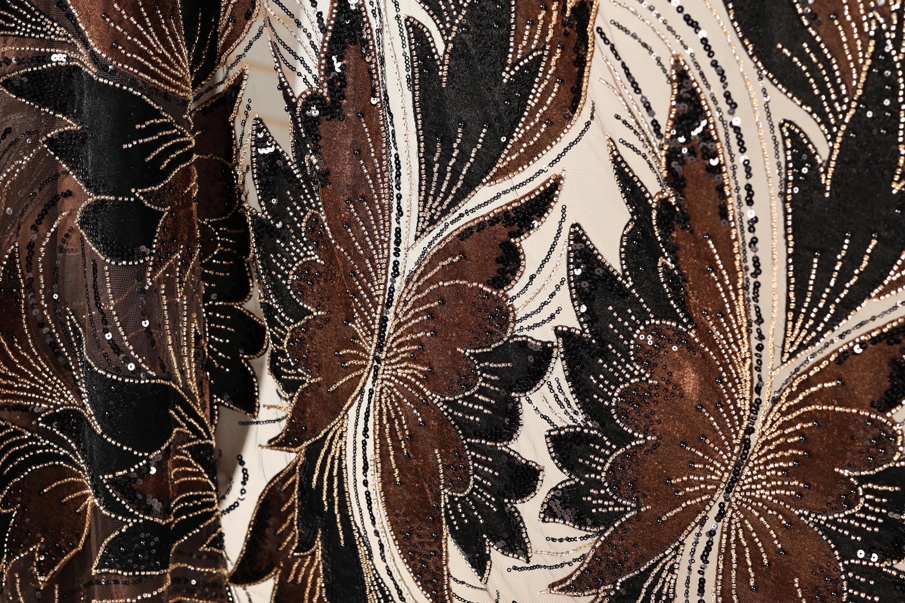 a close-up view of a fabric with a floral pattern, showcasing intricate details and textures.