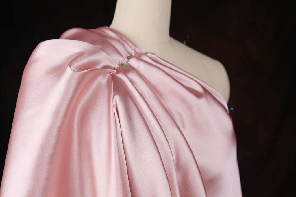 a dress on a mannequin wearing a pink dress