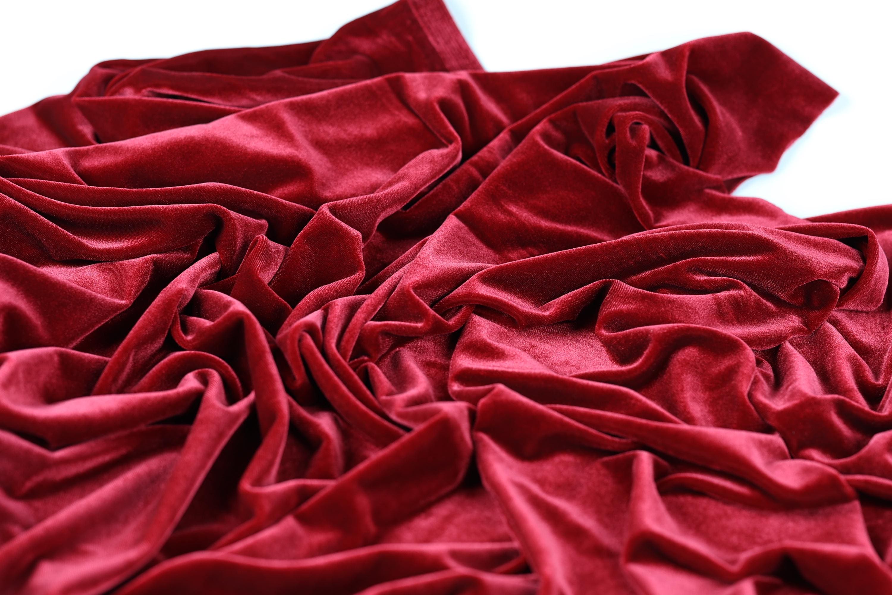 a close-up view of a crumpled, red velvet fabric.
