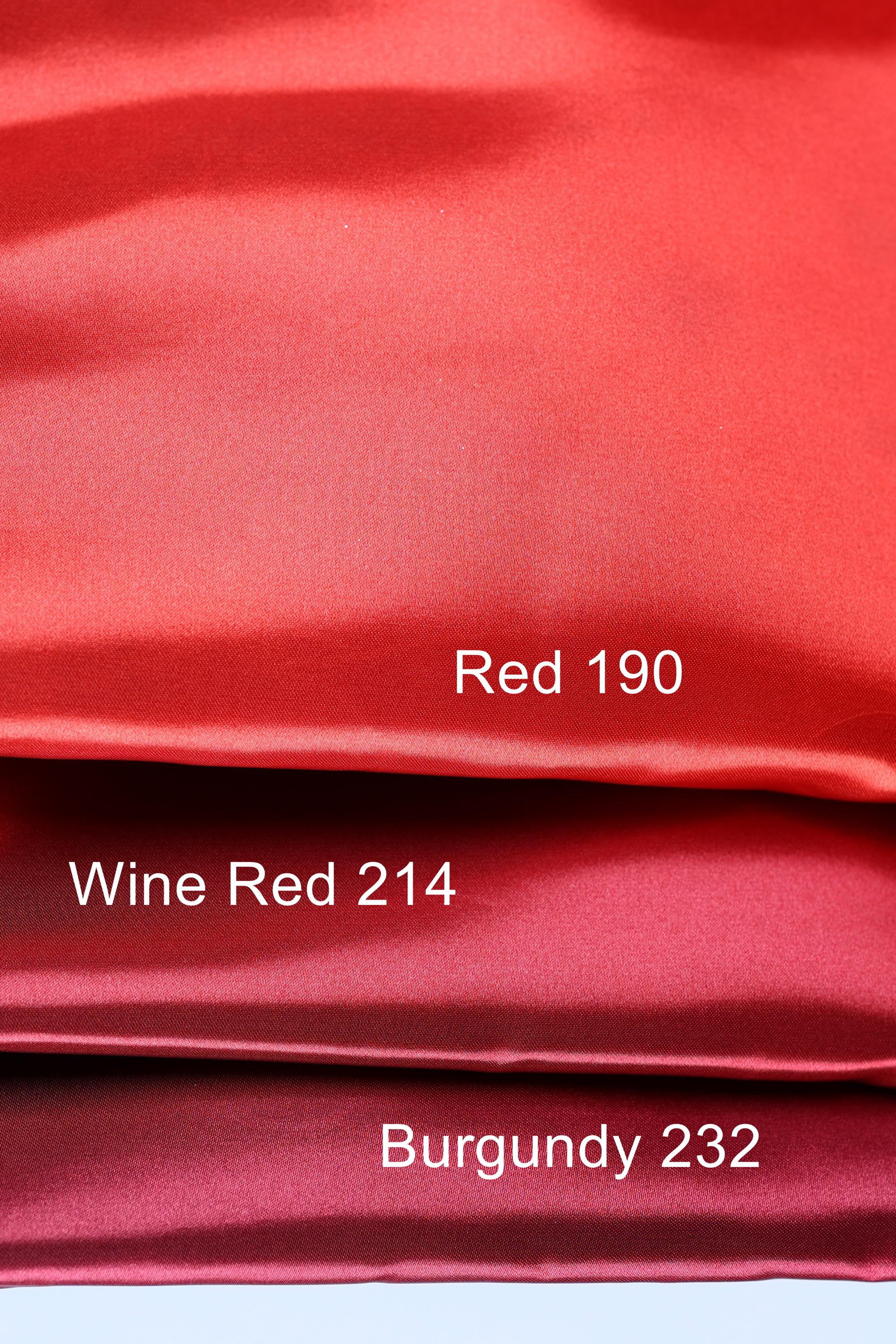 three different shades of red fabric, with the topmost shade being a vibrant red, the middle shade being a slightly darker red, and the bottom shade being a more muted red. The text labels the colors as "Red 190", "Wine Red 214", and "Burgundy 232".