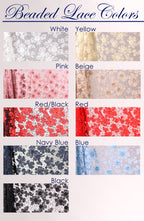 a collection of various colored lace fabrics, including white, yellow, pink, beige, red/black, navy blue, and black.