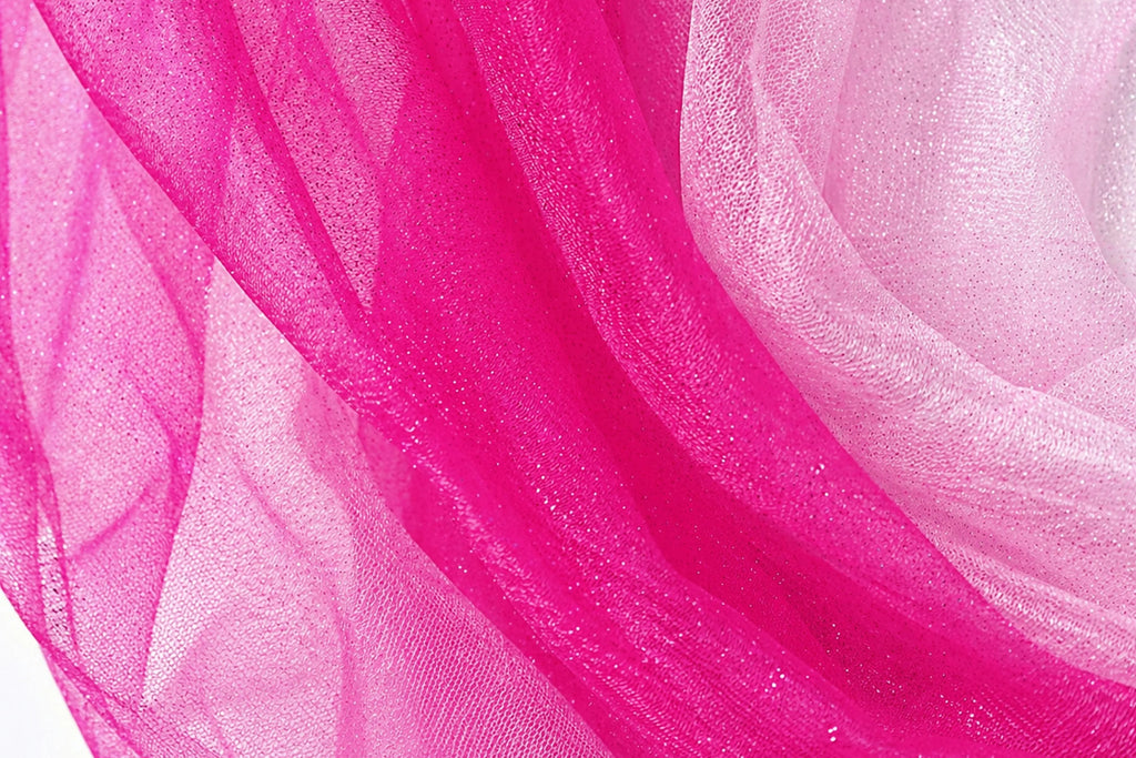 a close-up view of a fabric with a pink and white color scheme, with the pink fabric appearing more vibrant and the white fabric appearing more subdued.