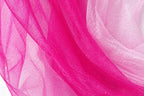a close-up view of a fabric with a pink and white color scheme, with the pink fabric appearing more vibrant and the white fabric appearing more subdued.