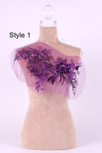 A mannequin with a pink floral design on its chest, featuring purple flowers and leaves.