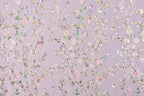a vibrant and intricate floral pattern with various shades of pink, white, and green flowers and leaves. The pattern is composed of numerous small flowers and leaves, creating a visually striking and detailed design. The overall composition is visually engaging and captivating, with the colors and patterns creating a sense of depth and complexity.