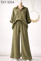 a mannequin wearing a green button-up shirt and wide-leg pants.