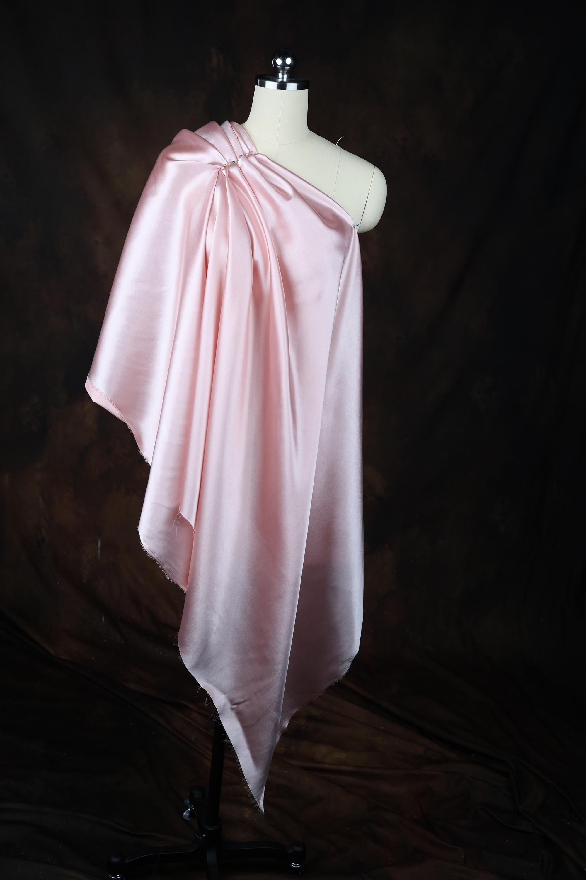 a dress on a mannequin on a black background