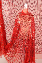 a red sequin fabric with a geometric pattern, creating a visually striking and eye-catching design.