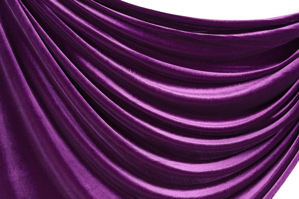 a close-up view of a shiny, purple satin fabric with a smooth, flowing texture.