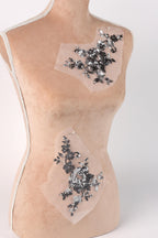 a mannequin torso with two pieces of fabric attached to it, one on the left side and one on the right side.