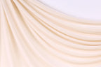 a close up of a curtain with a white background