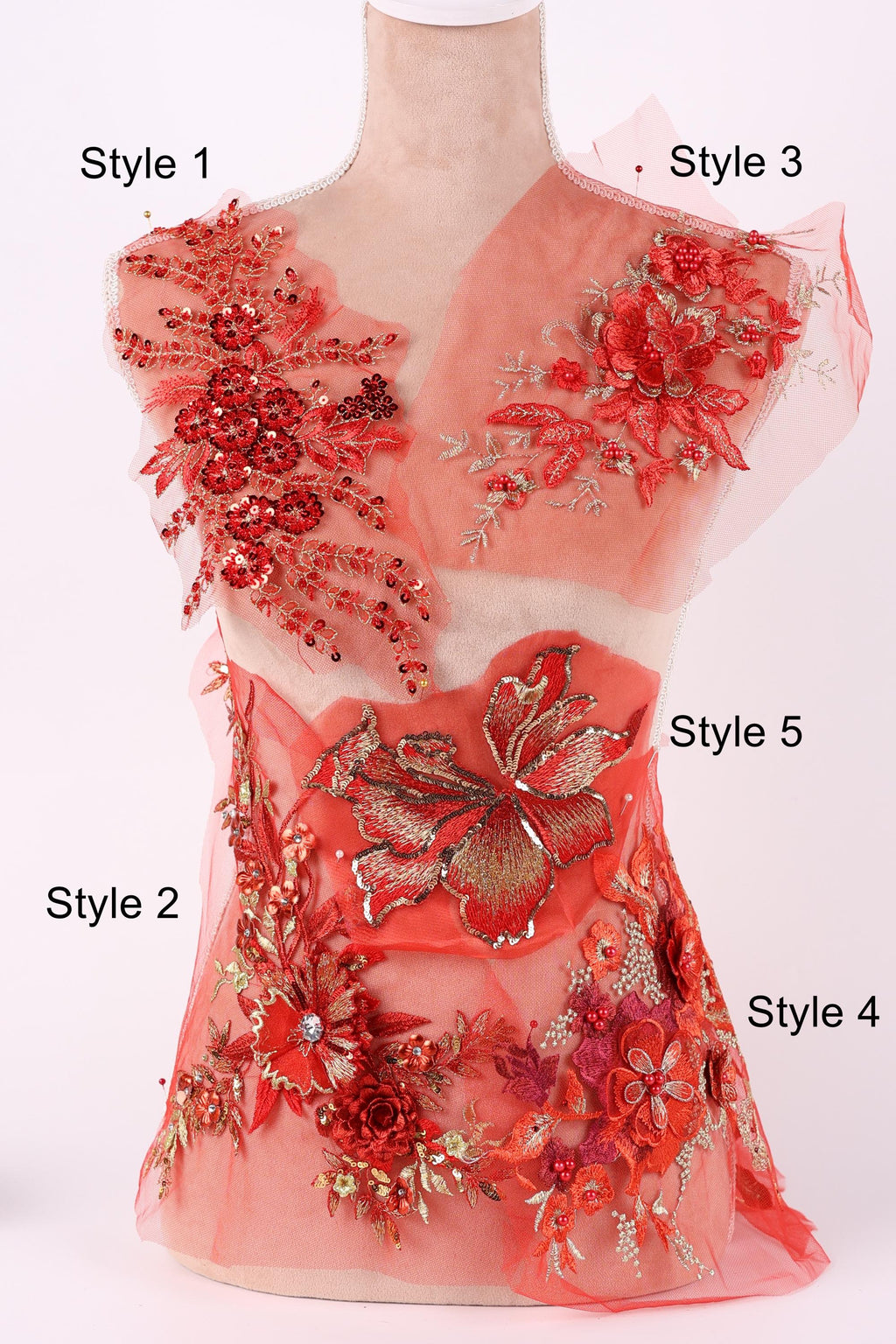 A mannequin with a red floral dress on display, featuring various styles of floral embroidery and embellishments.