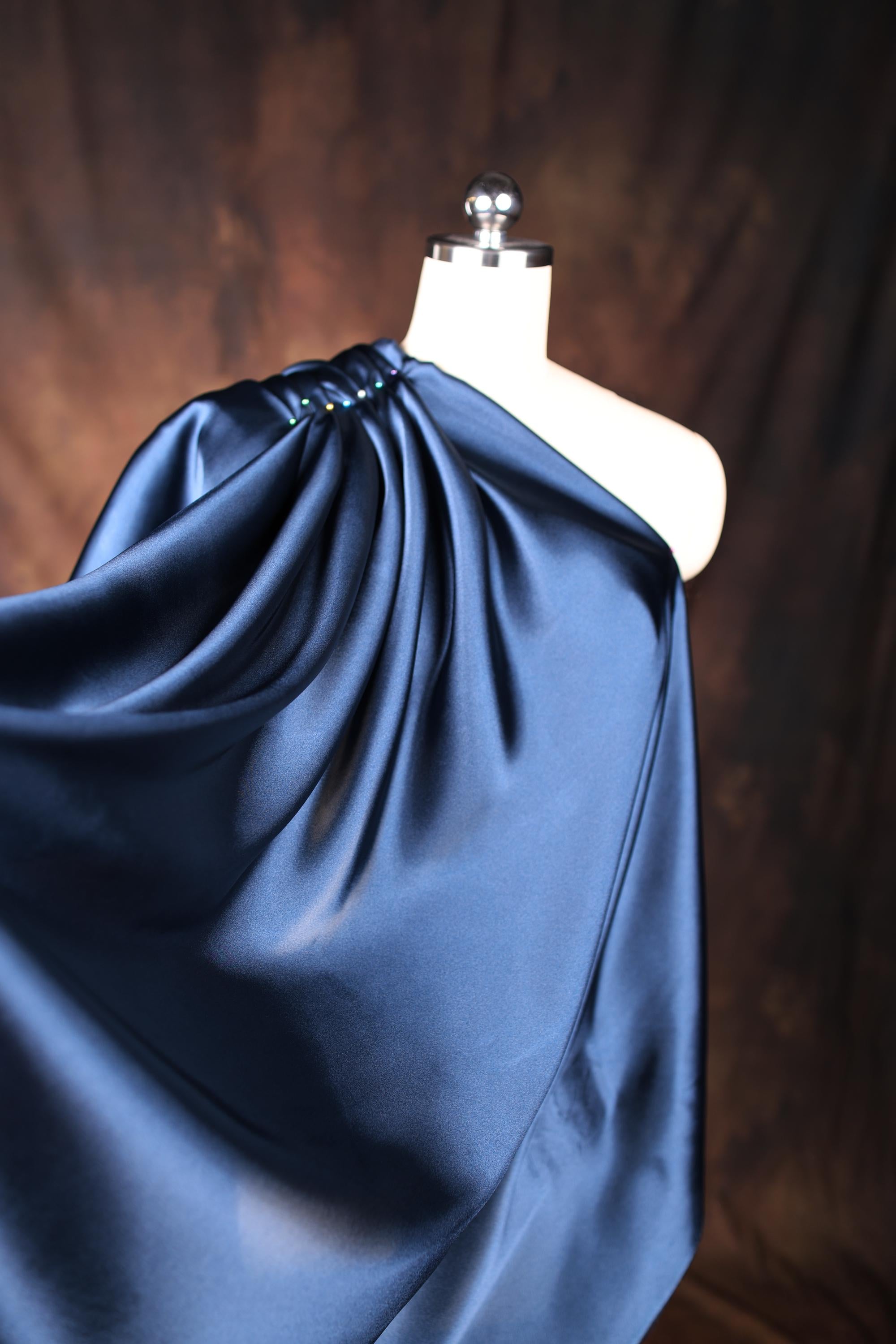 a mannequin wearing a blue dress on a mannequin