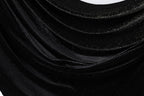 The image is a close-up of a shiny black fabric with a sparkling texture, creating a visually striking contrast.