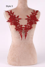 A mannequin with red floral embroidery on its bust area.