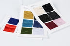 a collection of fabric swatches, each with a different color and pattern, arranged on a white background.