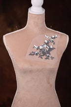 a mannequin with sequins and a piece of plastic