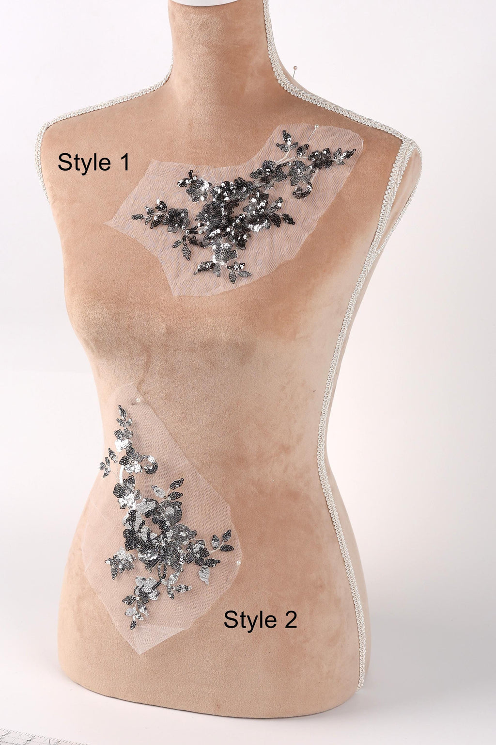 A mannequin with two different styles of embellishments on its bust. The mannequin is positioned against a white background, and the two styles are labeled as Style 1 and Style 2.