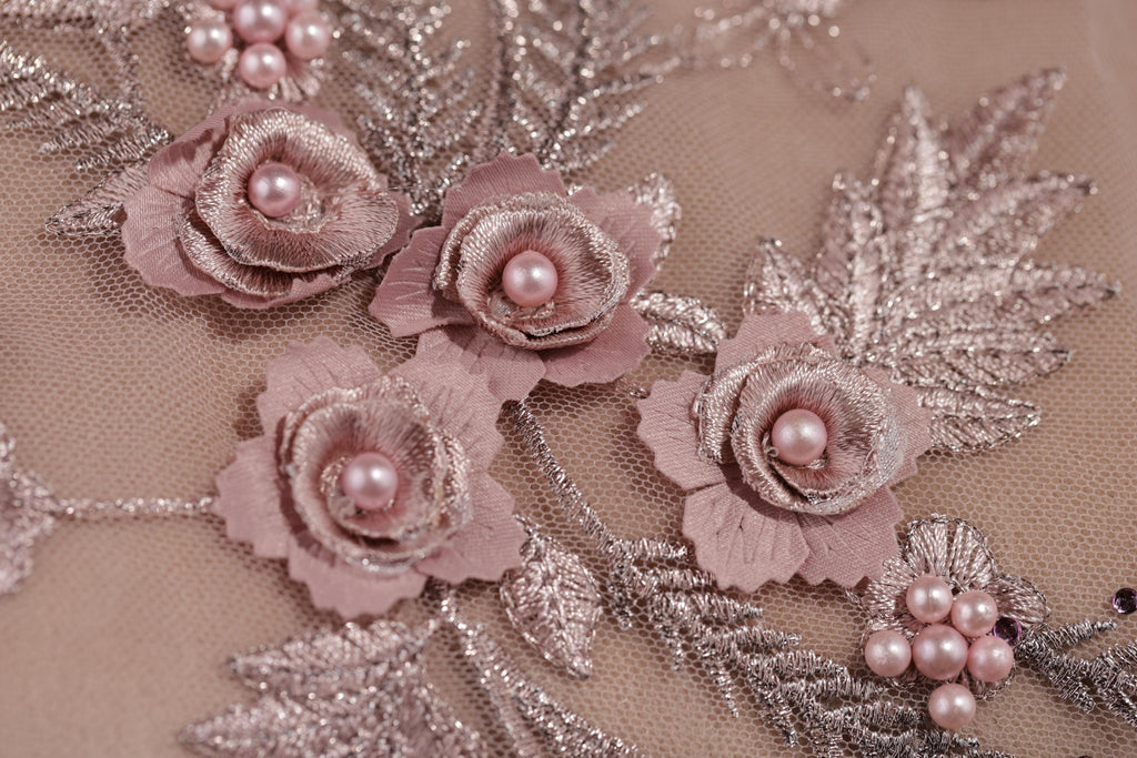 a close up of a dress with flowers on it