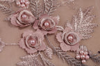 a close up of a dress with flowers on it