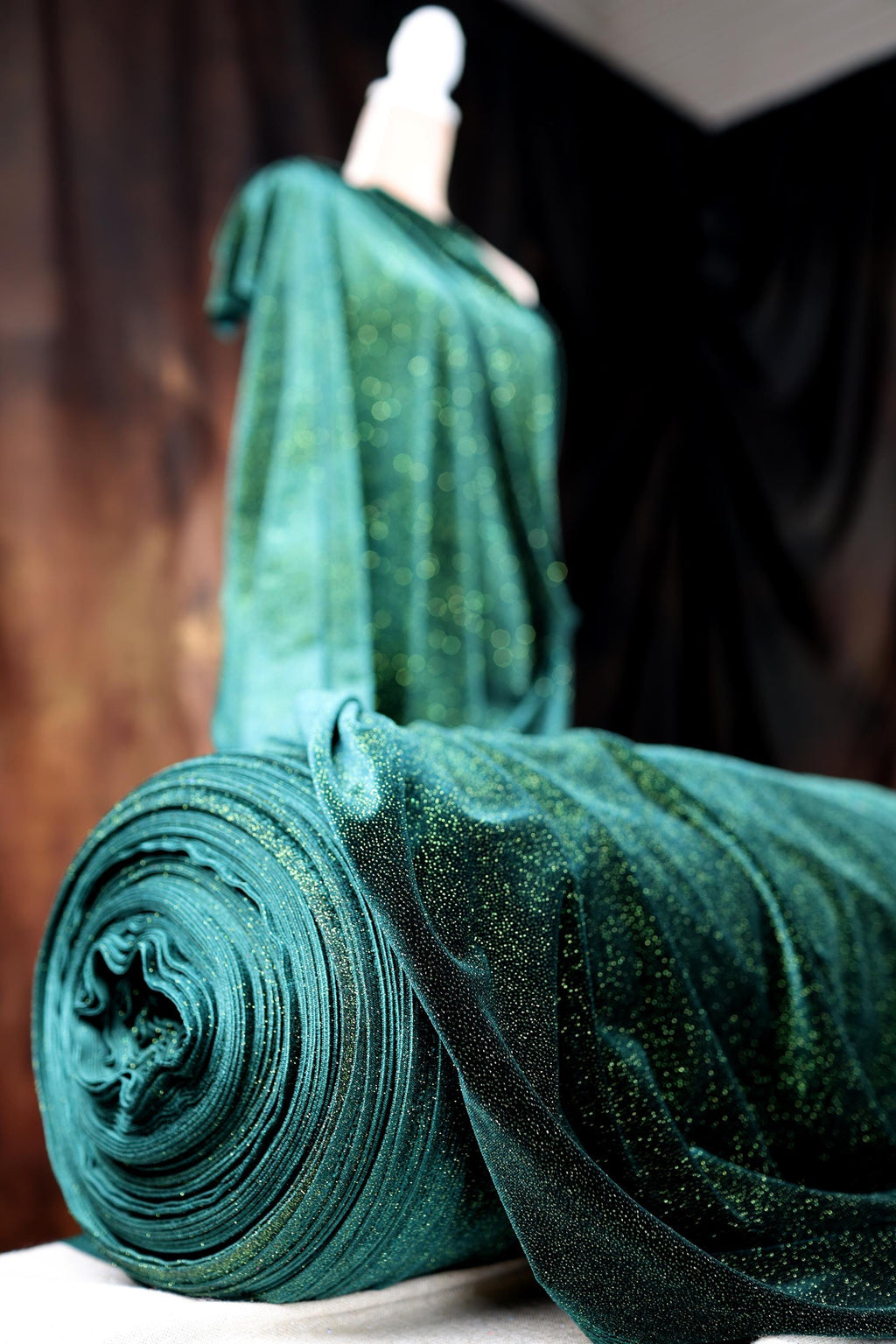 a green piece of cloth sitting on top of a table
