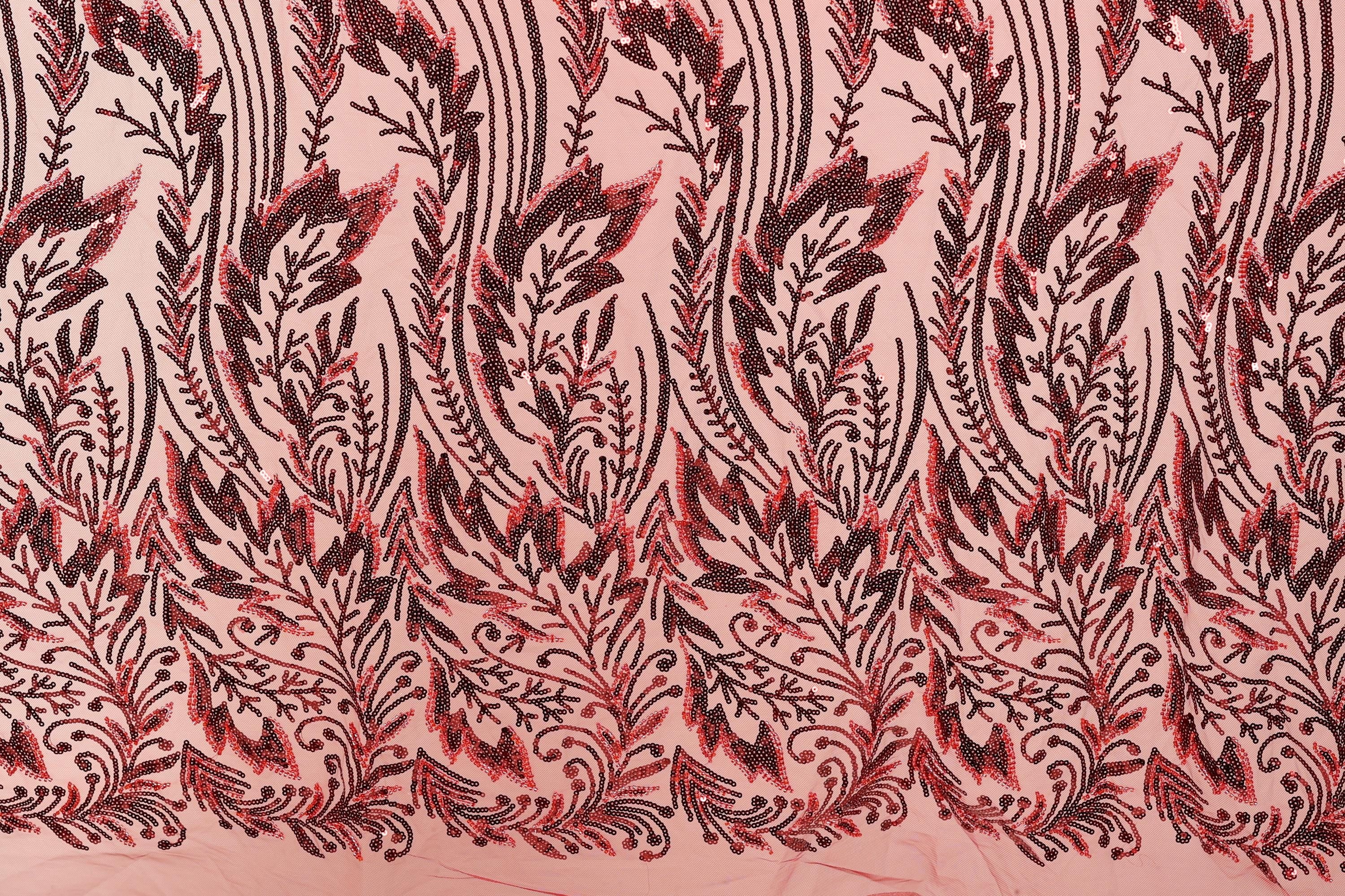 a close-up view of a fabric with a repeating pattern of red and black floral designs. The pattern consists of stylized leaves and flowers, creating a visually striking and intricate design. The fabric appears to be made of a light-colored material, which contrasts with the dark red and black colors of the floral pattern. The image does not contain any text or other discernible objects, and the focus is solely on the detailed floral design.