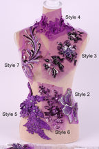 A mannequin with various purple and black floral and sequin designs on its body, including different styles such as Style 4, Style 5, Style 6, and Style 7.