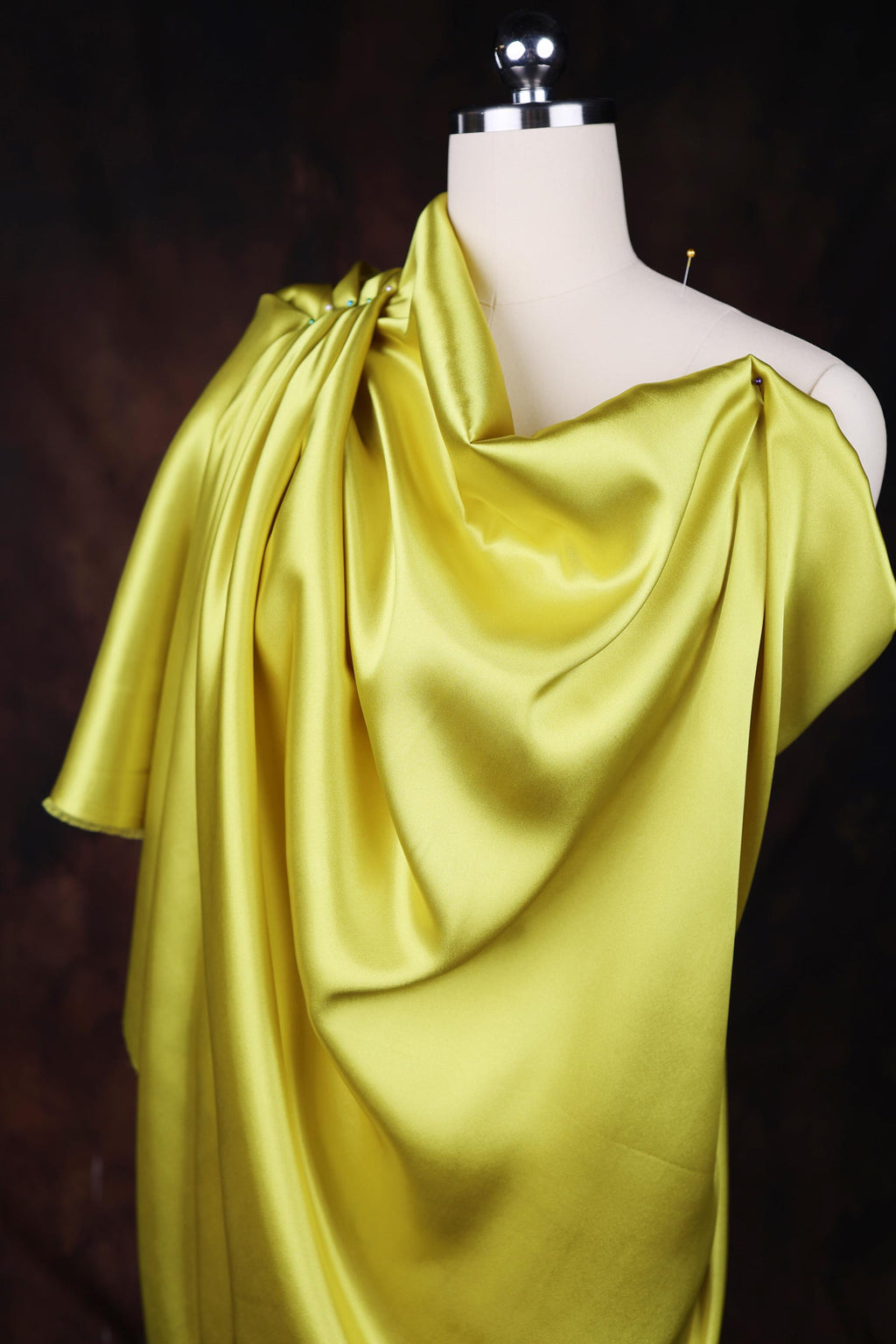 a mannequin with a yellow dress on it