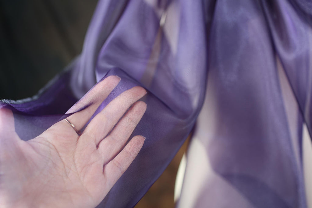 a woman's hand with a ring on it