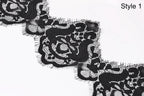 a close-up view of a black lace fabric with intricate floral patterns.